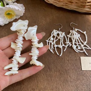 French style shell tassel earrings with white beads for an elegant dopamine vacation look