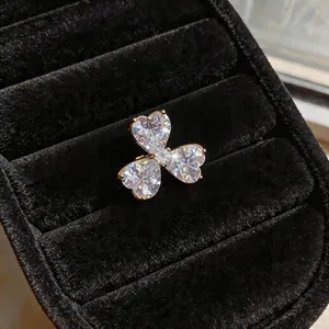 Close-up of a sparkling zircon heart flower ear cuff displayed on black velvet