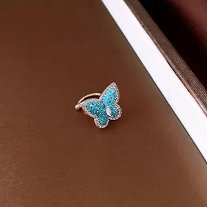 Sparkling zircon butterfly ear cuff with turquoise stones for non-pierced ears, silver finish