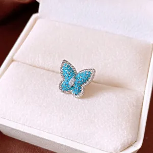 Elegant silver butterfly earring with turquoise beads and marquise zircon in a white box