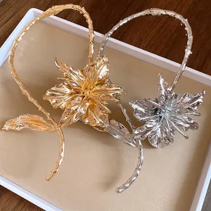 Elegant gold and silver metallic textured flower chokers for sophisticated jewelry design.