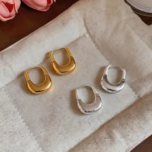 Elegant 18K gold plated U-shaped hoop earrings featuring a unique crinkled texture