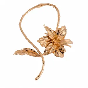 Elegant gold metallic lily flower choker necklace with unique textured leaf design for women
