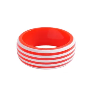 Vibrant red and white striped resin bangle in a bold geometric dopamine style