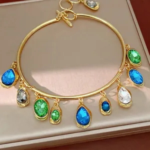 Elegant gold statement choker with colorful teardrop and oval crystals and OT clasp.