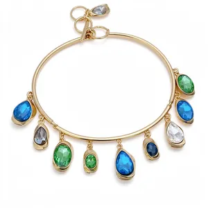 Bold gold-tone choker necklace featuring multi-colored teardrop crystal charms and OT buckle