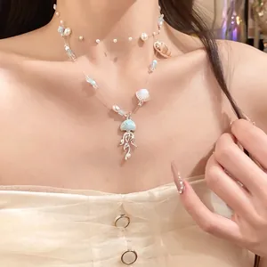 Elegant ocean-themed double-layer necklace with blue jellyfish charms and pearls