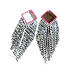 Exaggerated silver-tone tassel earrings with sparkling rhinestones for statement look