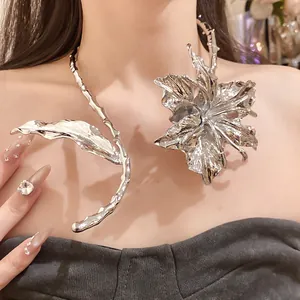 Detailed macro view of a silver crinkled metal flower and leaf statement choker necklace