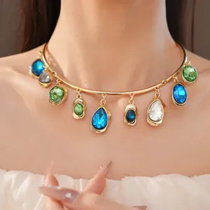 Detailed view of a gold-toned choker necklace with multi-colored teardrop crystals