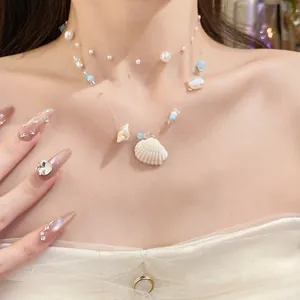 Detailed macro view of a summer ocean-style double-layer necklace with sea shells and pearls