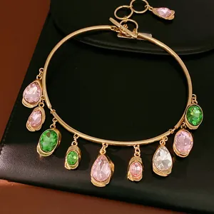 Statement gold choker with colorful teardrop gemstone pendants and retro OT clasp.