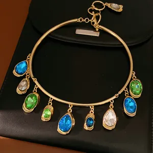 Detailed view of vintage gold choker necklace with colorful oval and teardrop charms
