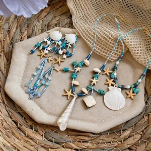 Parure de bijoux en perles avec étoile de mer et coquillages pour vacances à la plage
