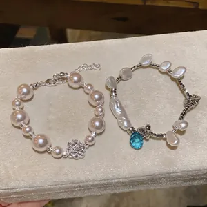 Elegant French style pearl bracelets with camellia charm and blue crystal detail