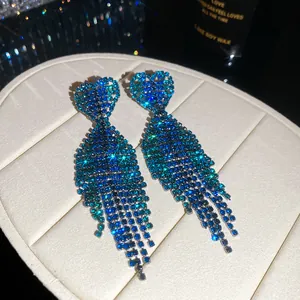 Close-up of elegant blue gradient rhinestone tassel earrings with heart-shaped tops