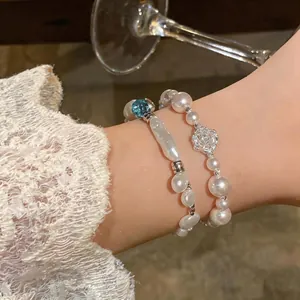 French style irregular pearl bracelet set with silver rose and blue bead detail