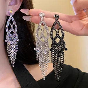 Exaggerated long fringe earrings featuring hollow design and rhinestones for elegant women