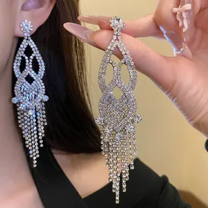 Exquisite close-up of sparkling rhinestone hollow tassel earrings with silver-tone finish