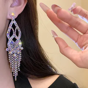 Detailed view of luxury rhinestone tassel drop earrings with sparkling silver crystals