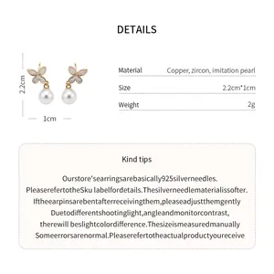 Detail view showing material and dimensions for these 18k gold butterfly earrings