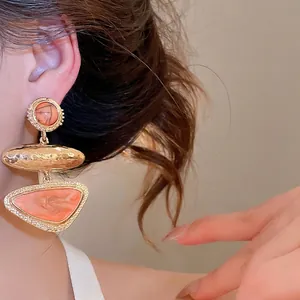 Retro geometric triangle dangle earrings in orange and gold, vintage fashion jewelry for women