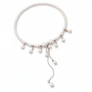 Elegant vintage pearl choker necklace with dangling teardrop pendants and a tassel chain