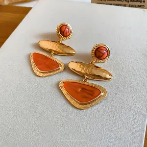 Vintage style geometric orange triangle drop earrings in gold-toned hammered finish