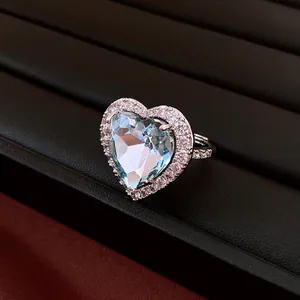Close-up of vintage heart-shaped blue zircon ring with micro-pave setting detail