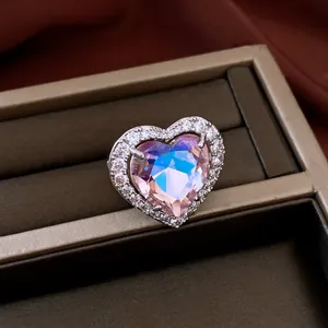 Close-up of a micro-pave zirconia heart-shaped adjustable ring in luxury style