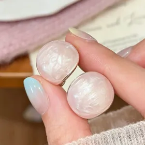 Elegant light pink oval drip oil stud earrings with pearlescent shimmer finish