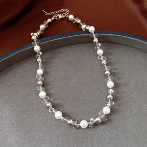 Detail view showing elegant pearl and crystal beaded adjustable necklace on a tray