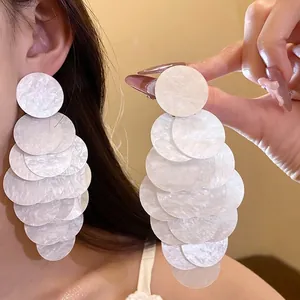Elegant white acrylic tassel earrings with pearly circle design for vacation beach style