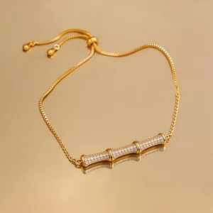 Close-up of elegant 18k gold plated bamboo bracelet with sparkling zircon stones