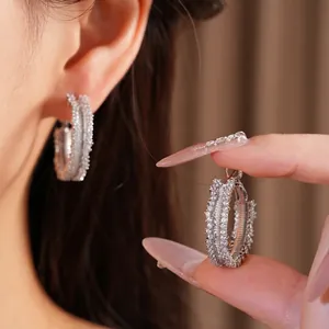 Elegant silver pin hoop earrings with micro-pave cubic zirconia for a luxurious style