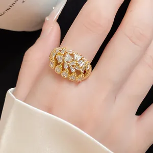 Detailed macro view of 18k gold plated hollow open ring with sparkling white zircon stones