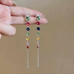 Detail shot of multi-color round zircon tassel earrings with sterling silver needles