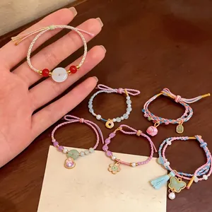 Exquisite handmade colorful woven rope bracelets featuring jade beads and flower charms