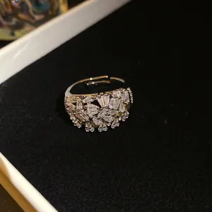 Macro detail of geometric open ring with sparkling baguette cut zircons