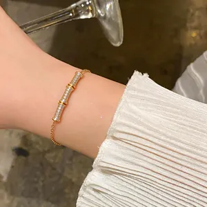 Elegant close-up view of 18k gold plated bamboo bracelet with sparkling pavé zircons on wrist