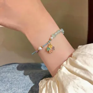 New Chinese style handmade woven bracelet featuring pearls and colorful four-leaf clover charm