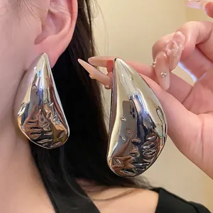 Elegant large silver teardrop earrings with a glossy metallic finish for modern women