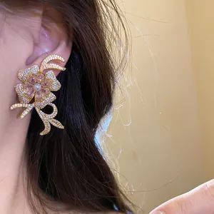 Elegant 18k gold plated flower stud earrings with sparkling zircon and pink pearl center