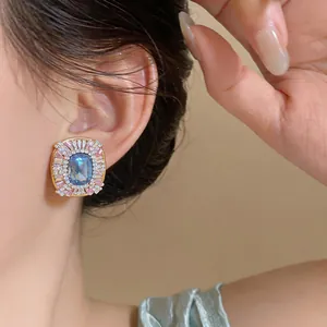 Detailed close-up of elegant French vintage style blue and pink crystal stud earrings