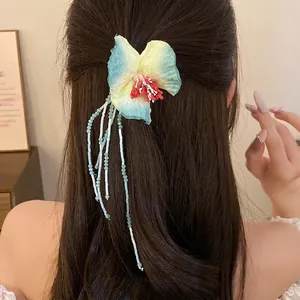 Elegant fabric flower hair clip with long beaded tassels for sweet summer vacation style