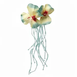 Elegant fabric flower hair clip with long beaded tassels in a refreshing forest style