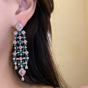 Detail view of luxury 18k gold plated flower tassel earrings with colorful zircons
