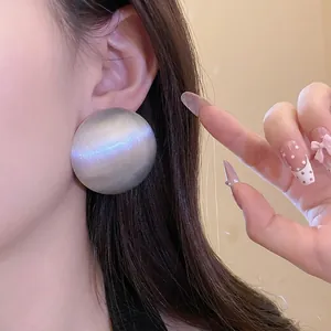 Oversized minimalist silver-toned round dome stud earrings for a vintage fashion statement