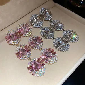 Vintage oval crystal drop earrings with sparkling rhinestones in a luxury jewelry box