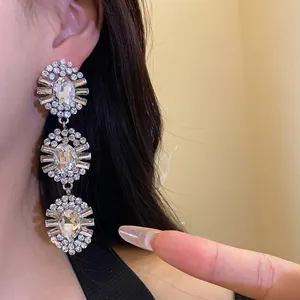 Elegant three-tier oval crystal tassel earrings with sparkling rhinestones for women